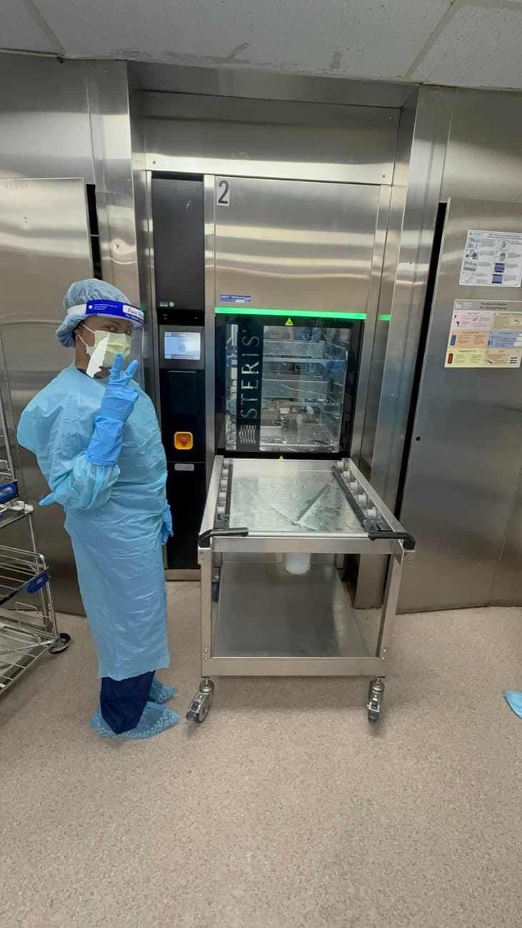 ATS-trained sterile processing technician at a hospital sterilizer